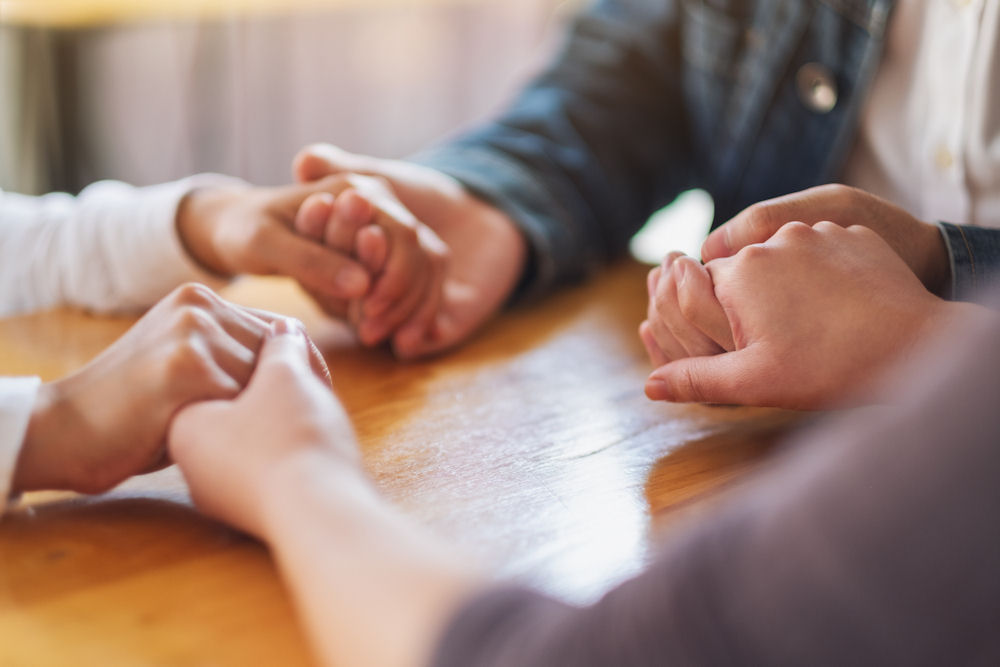 Three people holding hands during opioid addiction treatment in Pennsylvania Three people holding hands during opioid addiction treatment in Pennsylvania