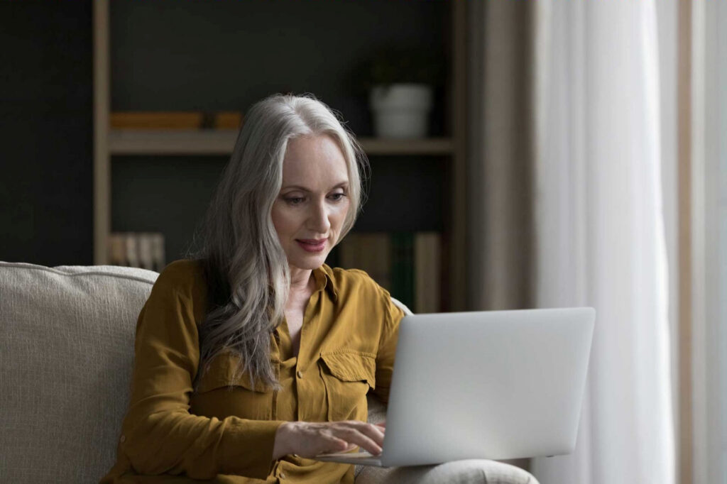 Woman reading headlines about zombie drugs online