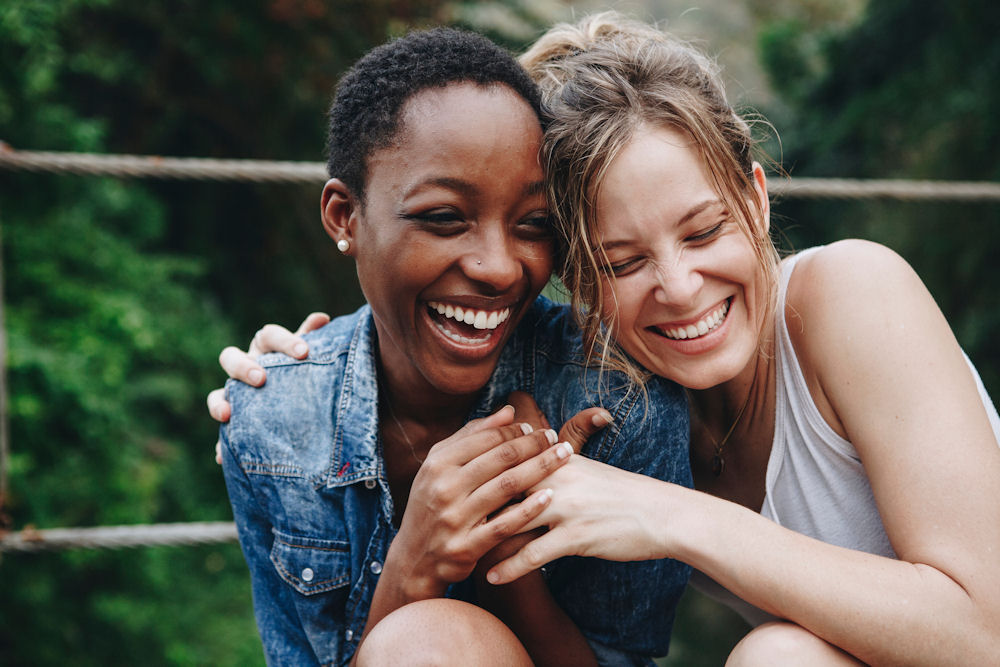 Women embracing during visit in rehab for prescription drug addiction.